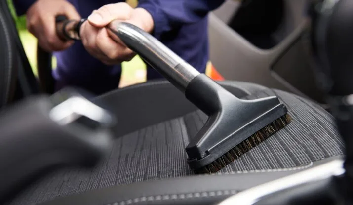 Car interior vacuuming and steam cleaning